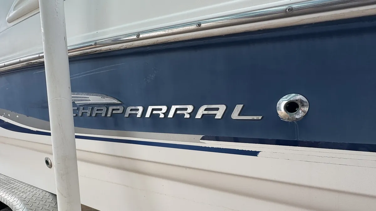 Before: Chaparral logo panel with faded, chalky, oxidized gelcoat
