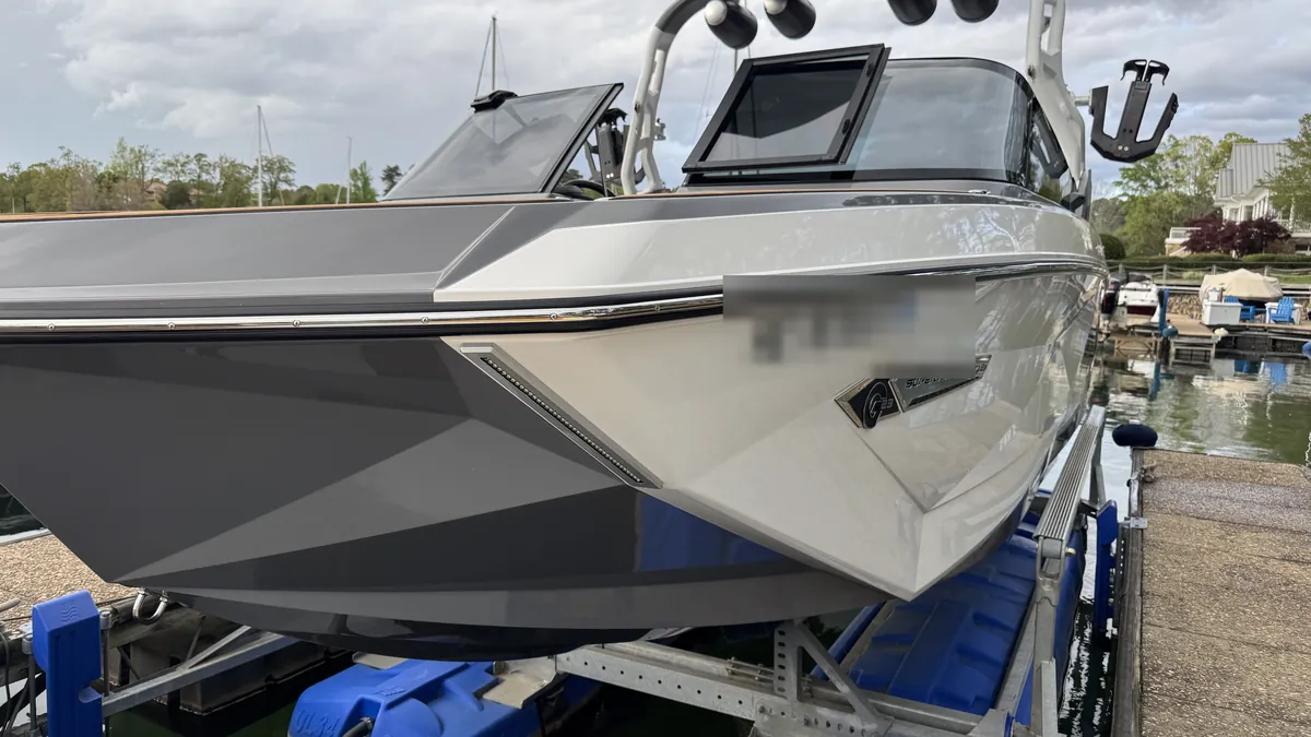 Surf boat: glossy bow at the marina